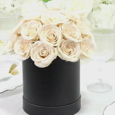 Ivory rose centerpiece arrangement in a black gift box.