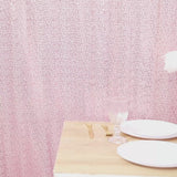 Pink sequin backdrop curtain for events and photo booths.