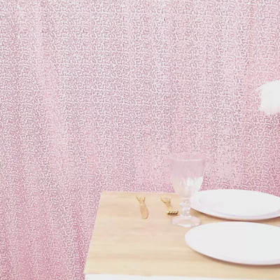Pink sequin backdrop curtain for events and photo booths.