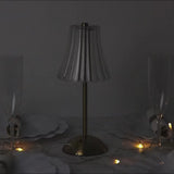 Cordless gold LED table lamp with floral table centerpiece setting
