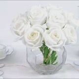 10 pcs white artificial silk roses in a clear vase for floral arrangements.