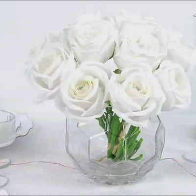 10 pcs white artificial silk roses in a clear vase for floral arrangements.