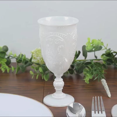 Pearl white vintage goblet with retro embossed design on a table setting.