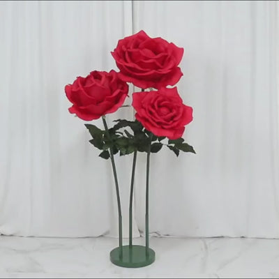 Giant red artificial rose set with base, perfect for events and photo booths.
