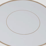 White round disposable table placemat with gold rim.