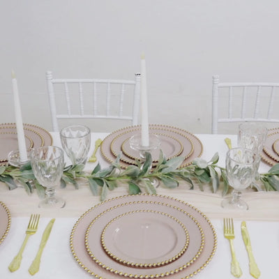 Taupe disposable dessert plates with gold beaded rim for parties.