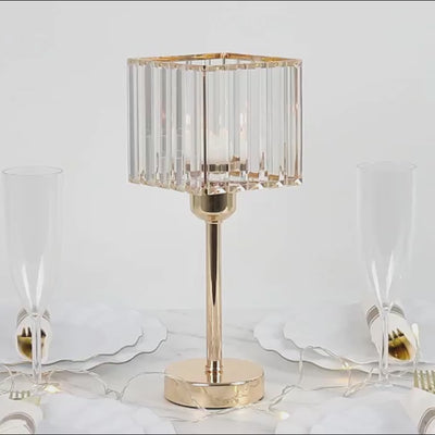 Gold crystal hurricane candle holder with a square design.