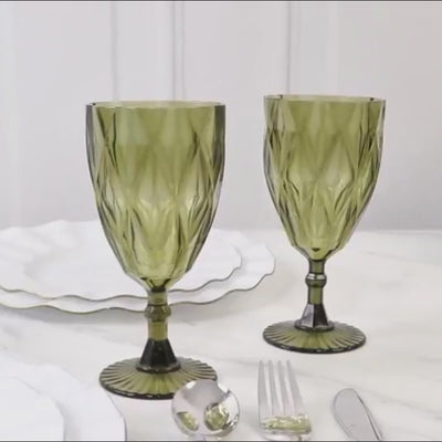Dusty sage green vintage diamond cut plastic goblets on a table setting.