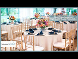 Elegant dining setup with high-quality scuba tablecloths and floral centerpieces.
