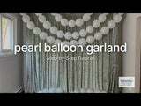 Pearl balloon garland decoration tutorial setup in a stylish indoor setting.