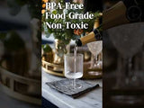 BPA-free food-grade non-toxic glass being poured with champagne in a stylish setting.