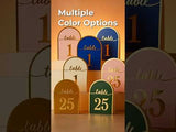Colorful table number signs in various designs and sizes.