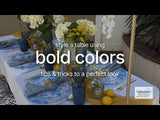 Table setting with bold colors and floral arrangements for a vibrant dining experience.