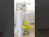 Premium acrylic display stand with flowers and decorative elements.