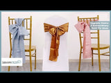 Chair sashes in blue, gold, and pink tied on elegant chairs