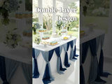 Elegant dessert table with double-layer design and floral decor.