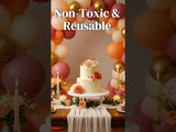 Elegant cake with floral decor in a festive setting of balloons and candles.