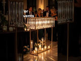 Elegant candle display for events with guests in formal attire.