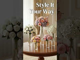 Elegant floral arrangements in various vases on a wooden table.