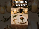 Elegant table setting with candles, flowers, and stylish dinnerware.