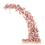 Floral arch decoration with pink roses and blooms on a white background