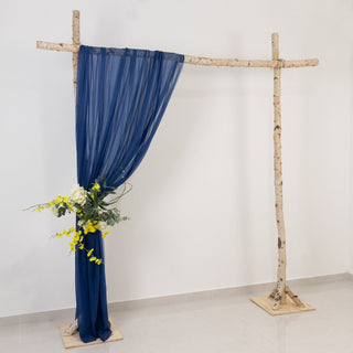 Rustic backdrop with navy drapery and floral arrangement
