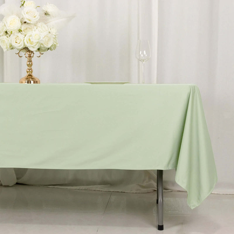 Sage green wrinkle-free tablecloth on dining table
