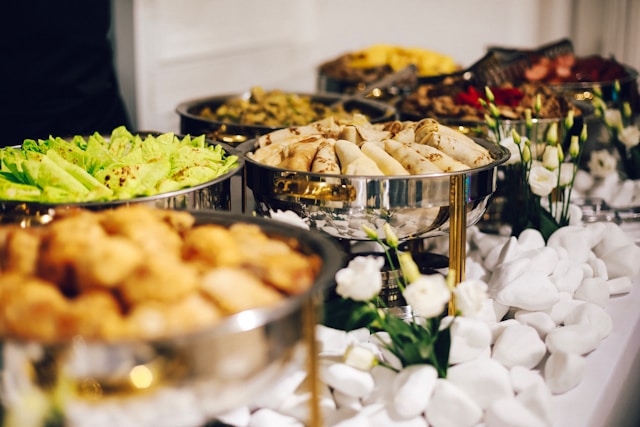 Buffet table with chafing dishes of assorted food