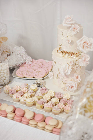 Engagement cake and assorted pastel desserts
