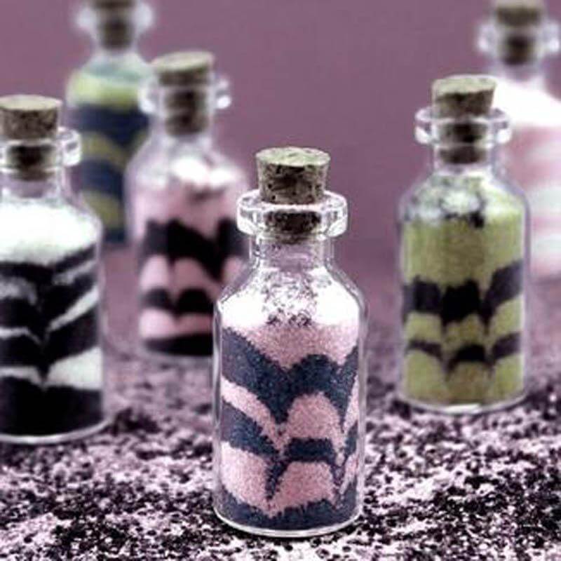 Glass bottles filled with colored sand