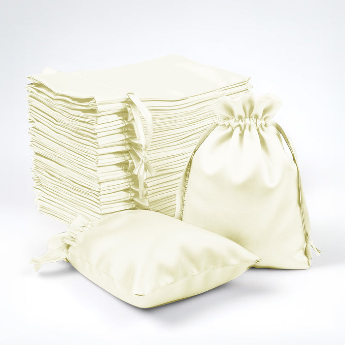 Set of cream fabric bags with drawstrings on a white background.