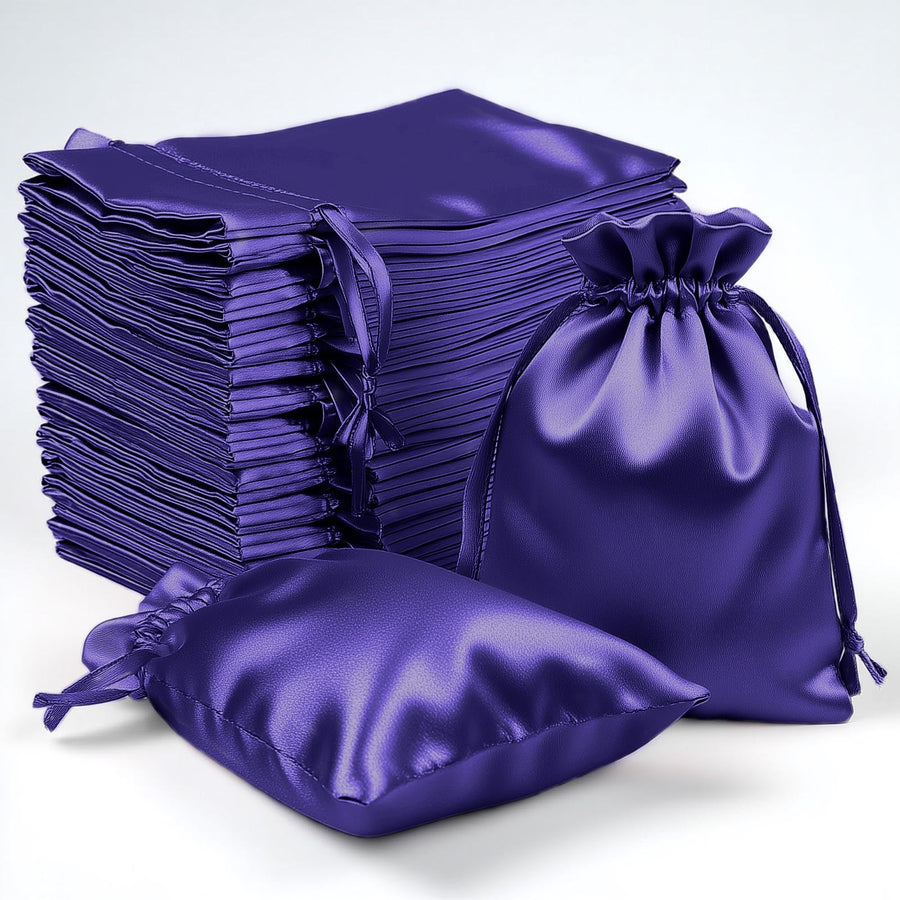 Satin purple drawstring bags stacked and arranged for packaging or gift use