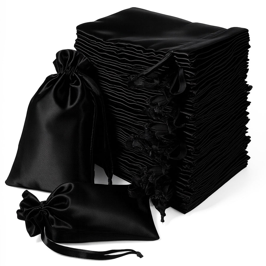 Stack of elegant black satin bags with drawstring closures