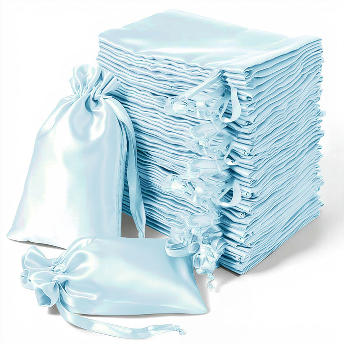 Light blue satin drawstring bags stacked and arranged elegantly against a white background