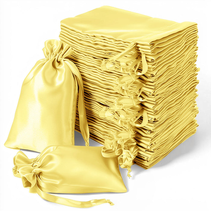 Stack of yellow satin drawstring bags for gifts or storage