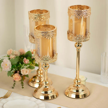 Set of 3 Lace Votive Candle Stands Antique Gold with Hurricane Glass Shades - Refined Pillar Candle Holders 13", 15", 17"