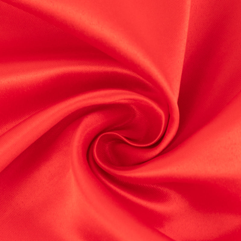 Red satin fabric close-up