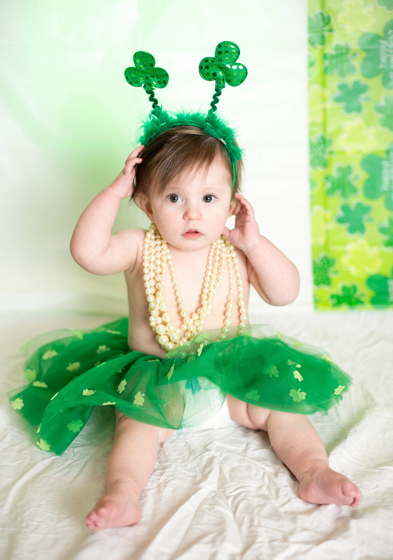 Baby in green tutu and shamrock headband