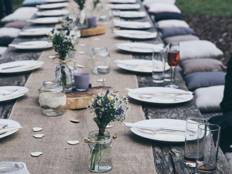 Table with floral centerpiece and place settings