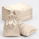 Set of beige satin drawstring bags, perfect for gifts or storage.