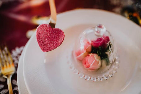 Valentine dessert table with red and pink treats