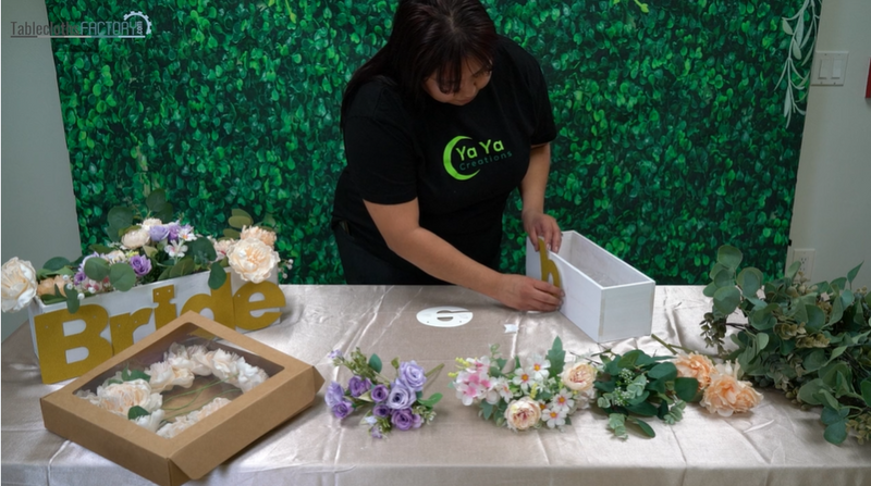 Woman decorating a planter box