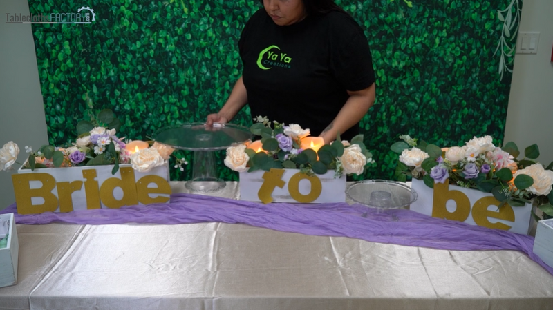 Woman putting cupcake display stands on the table