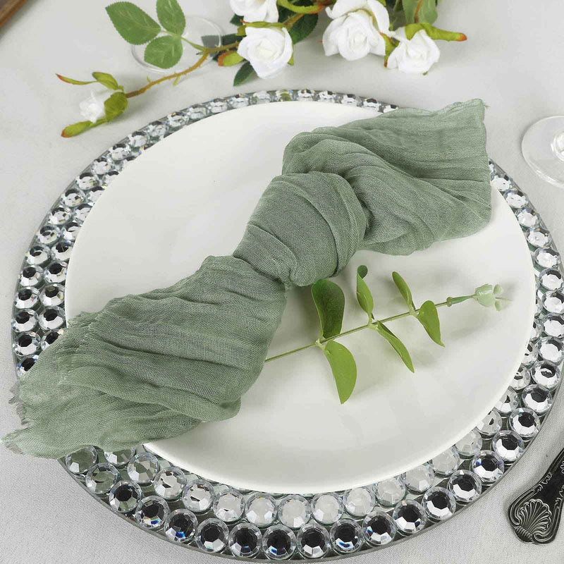 Dusty sage green cheesecloth napkin on a white plate