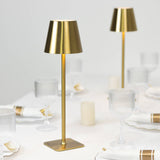 Elegant gold table lamp with a modern design, perfect for dining settings.