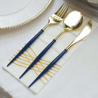 Elegant gold and navy cutlery set on a decorative napkin