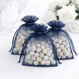 Navy organza bags filled with colorful pastel candies