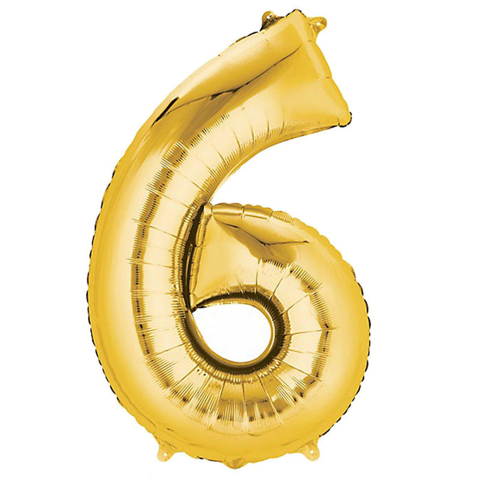 Gold foil number 6 balloon on a plain background