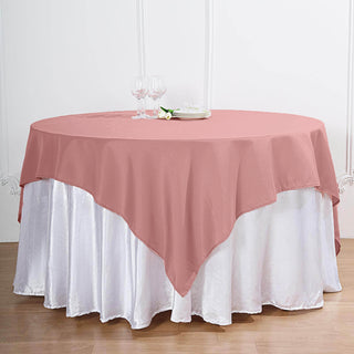 Elevate Your Event with the Dusty Rose Square Seamless Polyester Table Overlay
