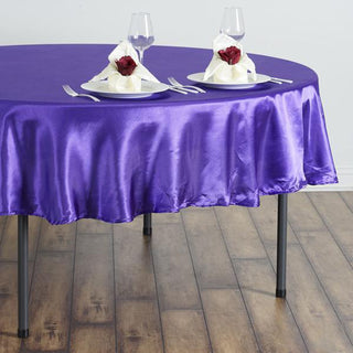 Add a Touch of Elegance with the 90" Purple Seamless Satin Round Tablecloth